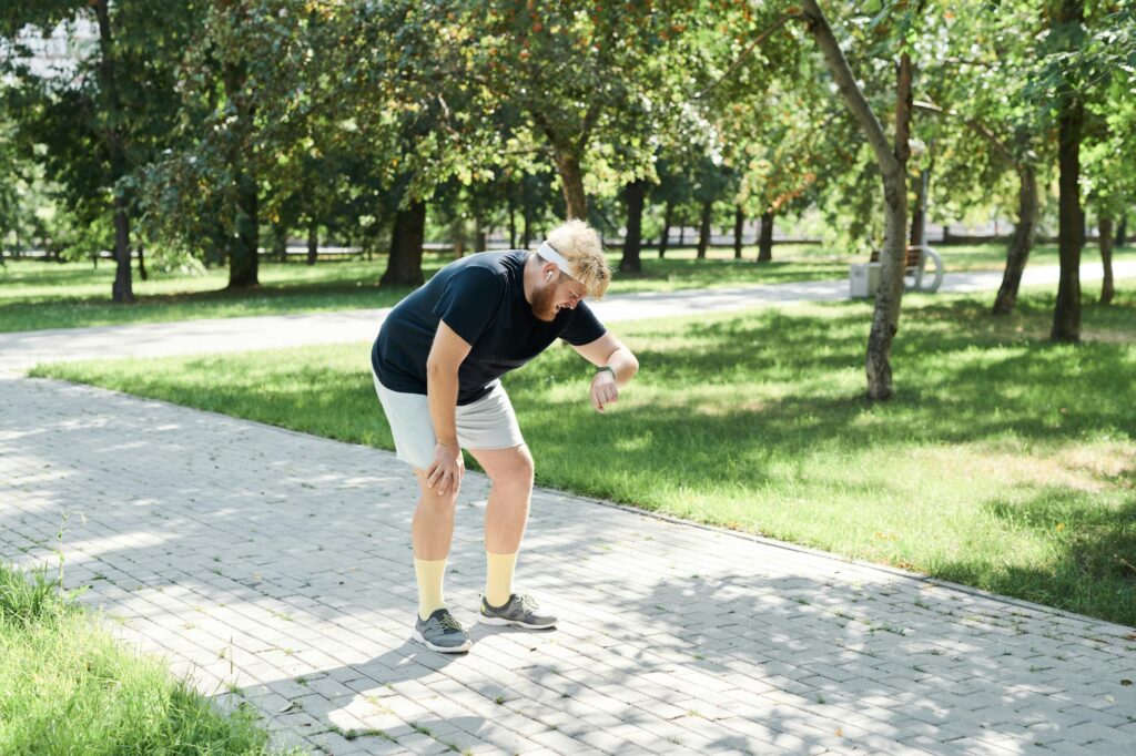 Runner using fitness tracker during training